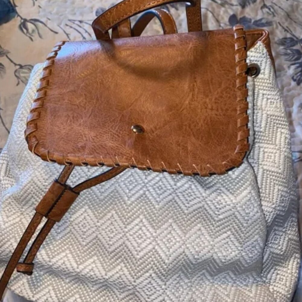 BCute little backpack with leather straps/detailing Gently used In good cackpack